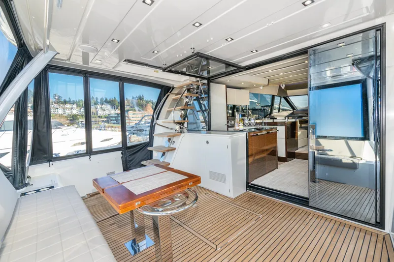 Slide: The Image of Luxurious 2018 Prestige 630 yacht interior with modern design and scenic marina view. - 22