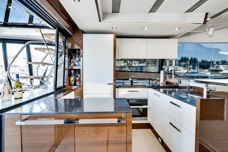 Slide: The Image of Luxurious kitchen interior on a 2018 Prestige 630 yacht, featuring modern design and amenities. - 26