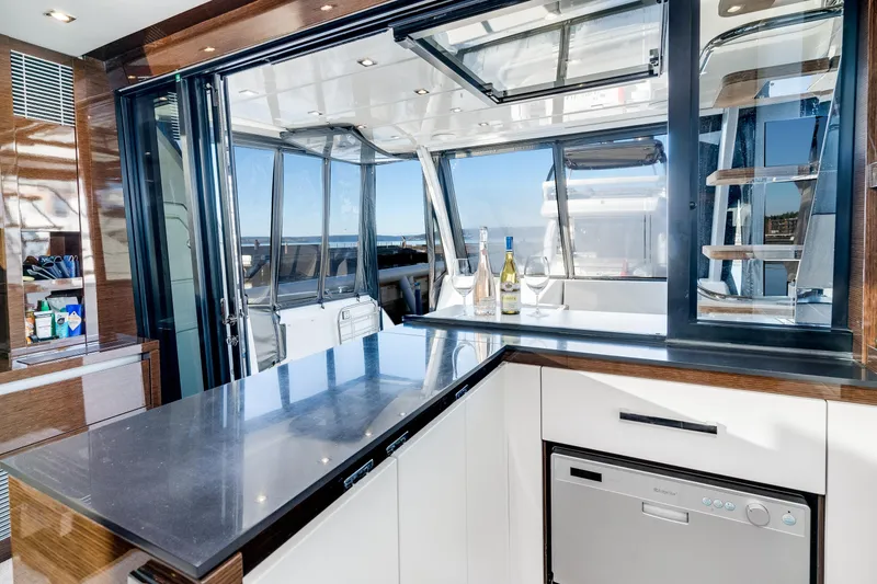 Slide: The Image of Luxurious interior of 2018 Prestige 630 yacht with modern kitchen and ocean view. - 28