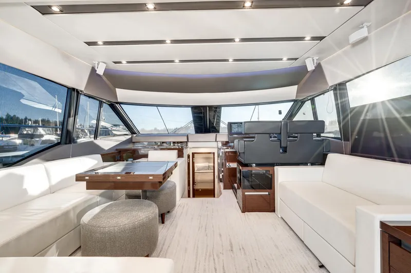 Slide: The Image of Luxurious interior of 2018 Prestige 630 yacht with modern seating and panoramic windows. - 30
