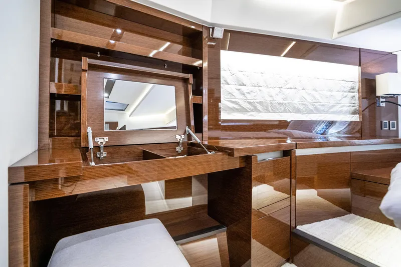 Slide: The Image of Luxurious interior of 2018 Prestige 630 yacht with elegant wood finish and mirror. - 43