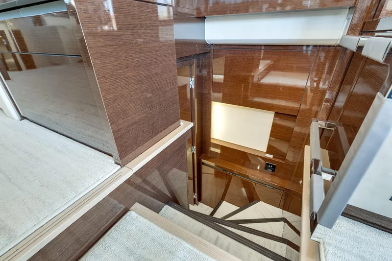 Slide: The Image of Luxurious interior staircase of 2018 Prestige 630 yacht with elegant wood finish. - 60