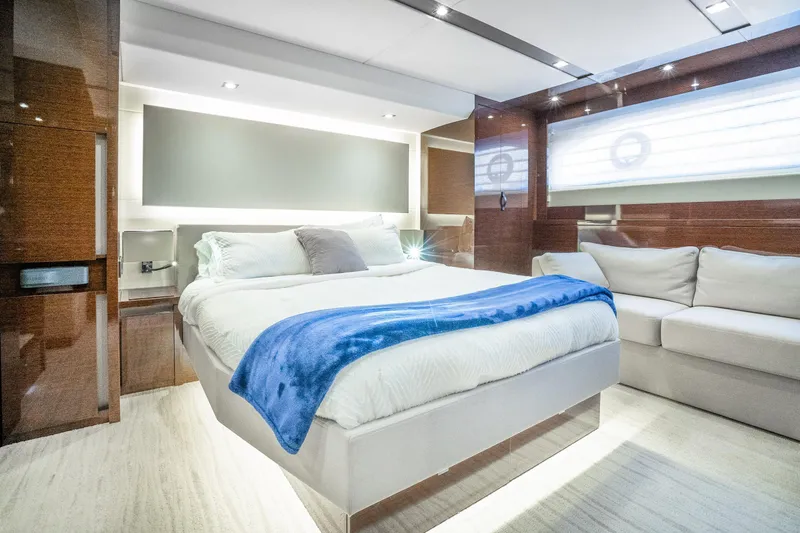 Slide: The Image of Luxurious bedroom interior of 2018 Prestige 630 yacht with modern design and cozy furnishings. - 62