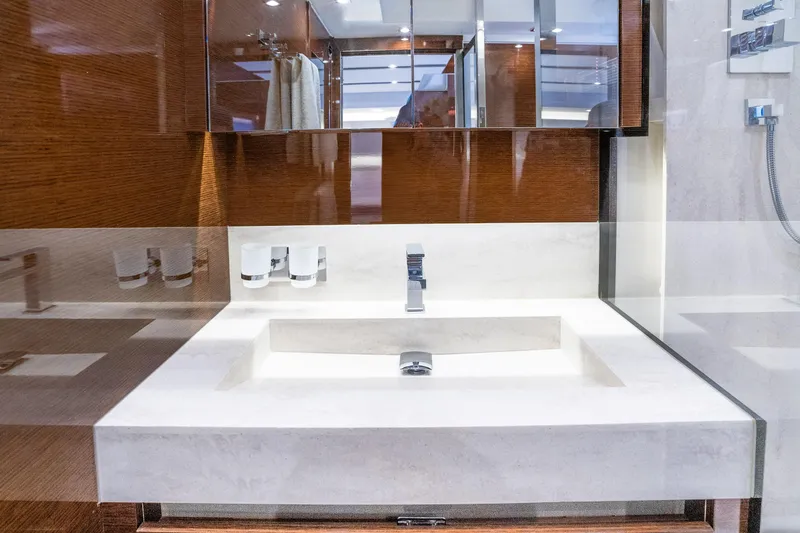 Slide: The Image of Luxurious bathroom sink in 2018 Prestige 630 yacht, featuring sleek design and modern fixtures. - 69