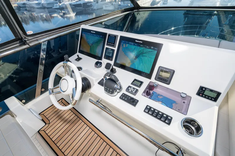 Slide: The Image of Cockpit of 2018 Prestige 630 yacht with advanced navigation systems and controls. - 7