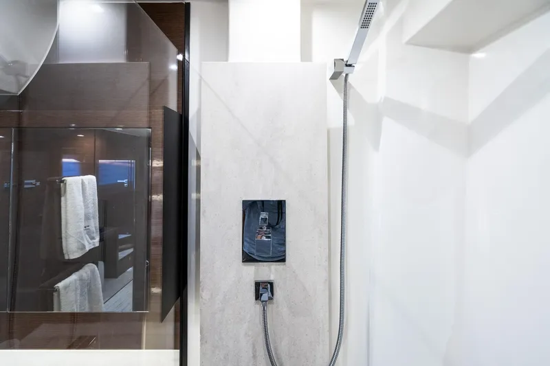 Slide: The Image of Modern shower area in 2018 Prestige 630 yacht, featuring sleek design and glass enclosure. - 72