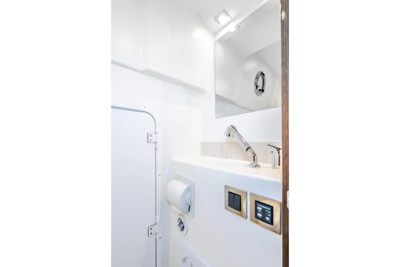Slide: The Image of Luxurious bathroom interior of 2018 Prestige 630 yacht with modern fixtures and sleek design. - 79