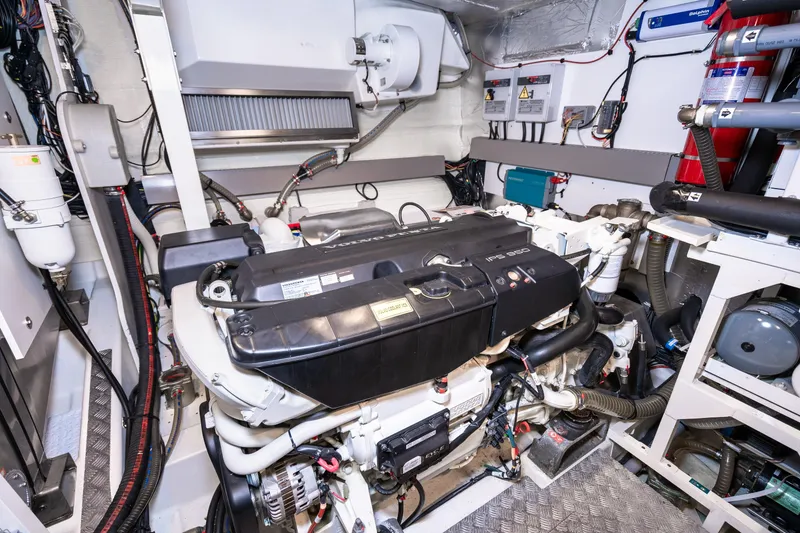 Slide: The Image of Engine room of a 2018 Prestige 630 yacht, featuring advanced mechanical systems. - 84