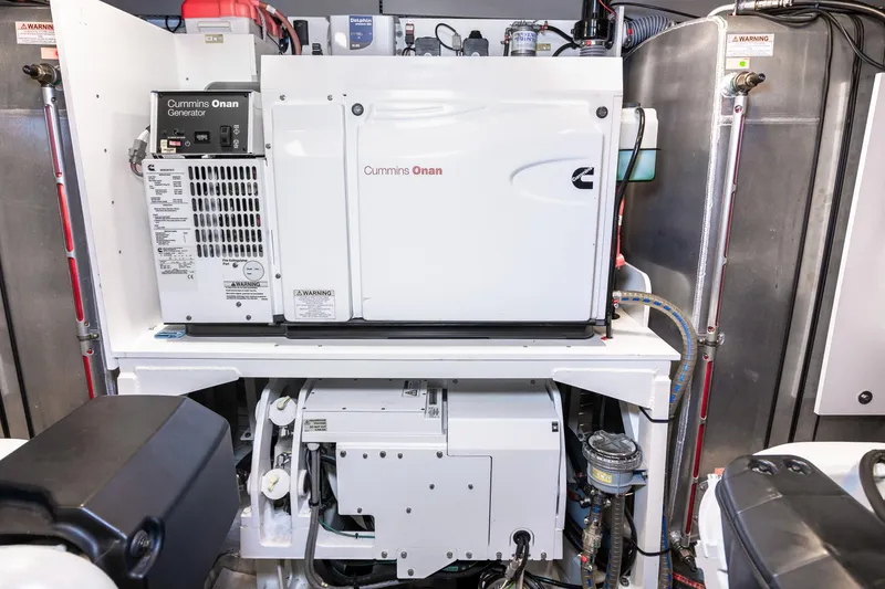 Slide: The Image of Engine room of 2018 Prestige 630 yacht featuring Cummins Onan generator. - 85