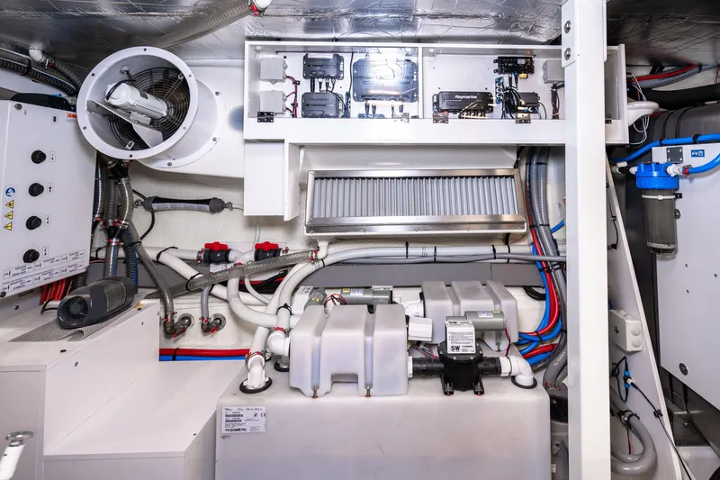 Slide: The Image of Engine room of a 2018 Prestige 630 yacht, showcasing mechanical and electrical systems. - 87