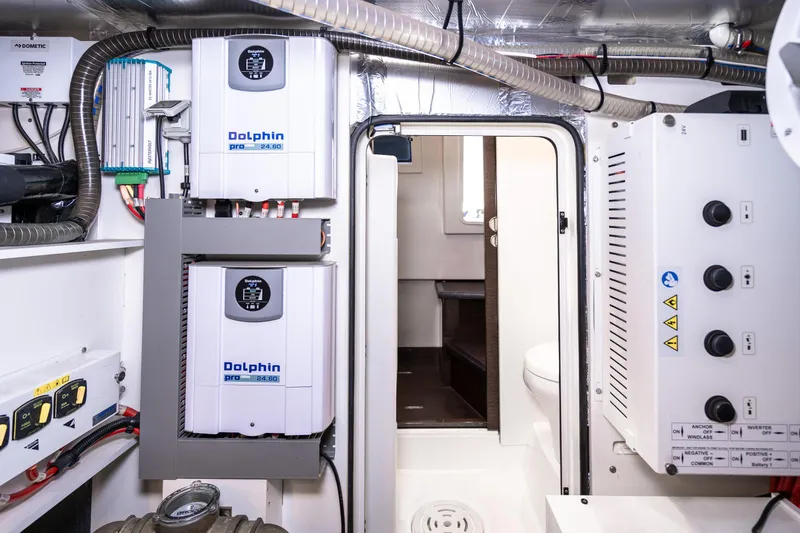 Slide: The Image of Engine room of a 2018 Prestige 630 yacht with electrical equipment and wiring. - 88