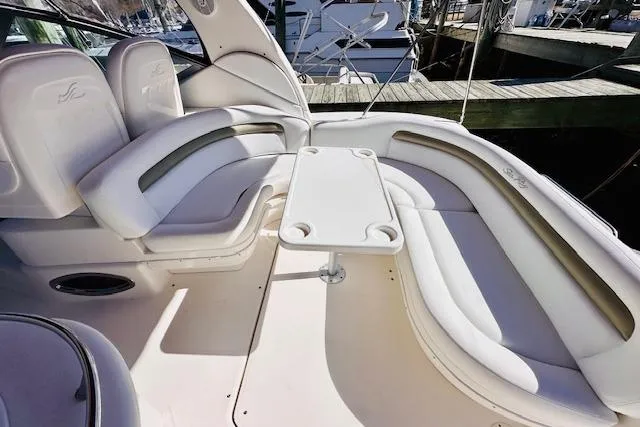 Slide: The Image of 2006 Sea Ray 340 Sundancer interior with white seating and table. - 10