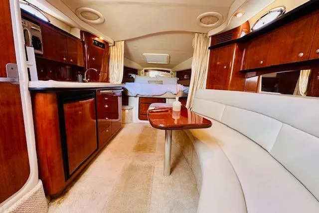 Slide: The Image of Luxurious interior of 2006 Sea Ray 340 Sundancer yacht with elegant wood finishes. - 24