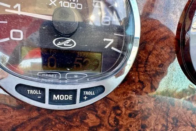 Slide: The Image of Close-up of 2006 Sea Ray 340 Sundancer dashboard with RPM gauge and controls. - 32