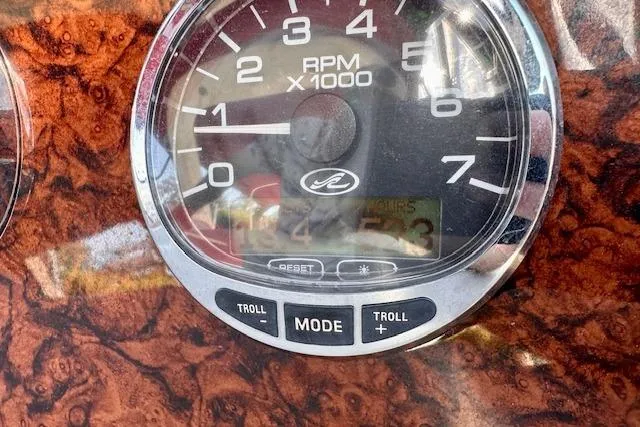 Slide: The Image of Tachometer of 2006 Sea Ray 340 Sundancer boat, showing RPM and control buttons. - 33