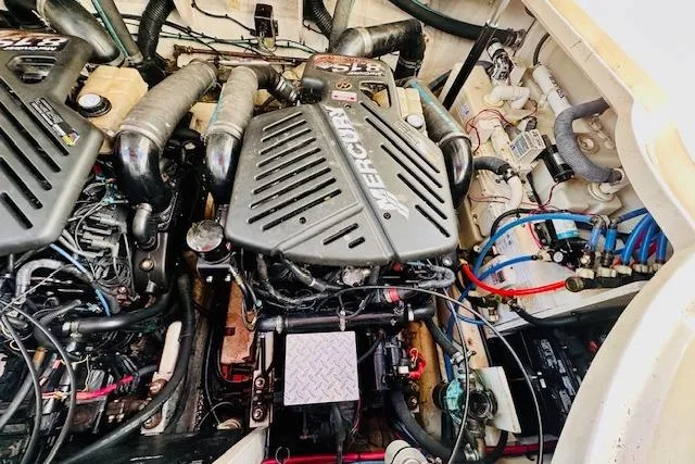 Slide: The Image of Engine compartment of a 2006 Sea Ray 340 Sundancer with Mercury engines. - 34