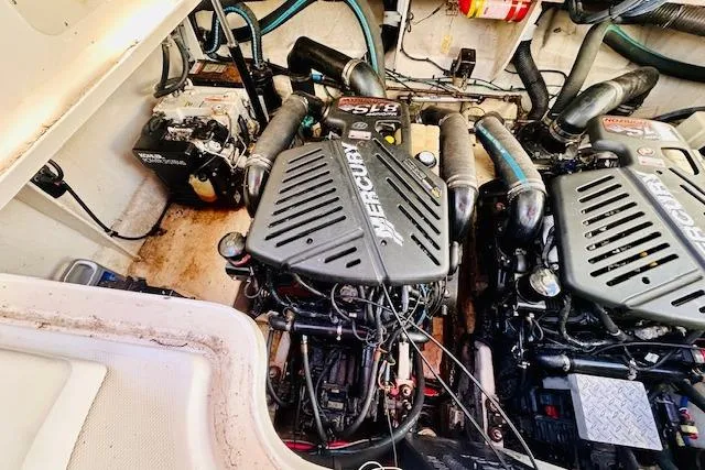 Slide: The Image of Engine compartment of a 2006 Sea Ray 340 Sundancer with twin Mercury engines. - 35