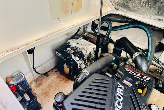 Slide: The Image of Engine compartment of a 2006 Sea Ray 340 Sundancer boat, featuring a Mercury engine. - 36