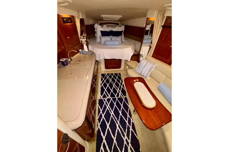 Slide: The Image of Luxurious interior of 2006 Sea Ray 340 Sundancer yacht with cozy bed and elegant decor. - 41