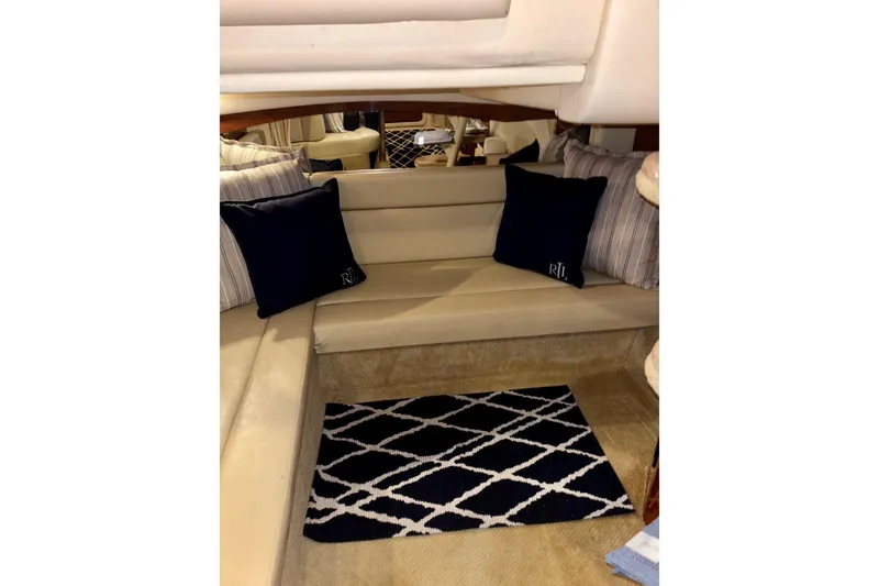 Slide: The Image of Interior of 2006 Sea Ray 340 Sundancer with beige seating and decorative pillows. - 43