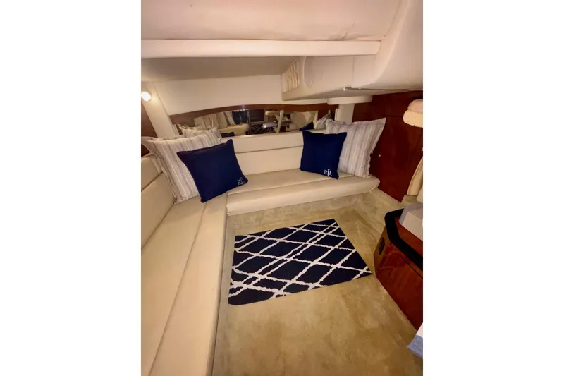 Slide: The Image of Interior of 2006 Sea Ray 340 Sundancer with cozy seating and nautical decor. - 44