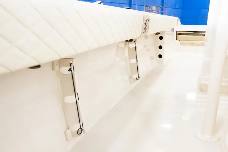 Slide: The Image of Manufacturer Provided Image: 2026 Carolina Skiff 26 Ultra Elite interior detail, showcasing sleek white seating and storage features. - 12