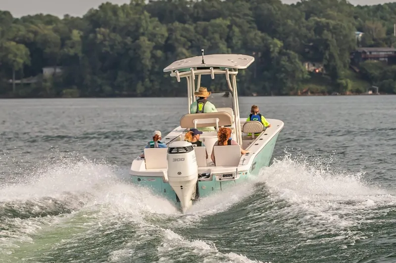 Slide: The Image of 2026 Carolina Skiff 26 Ultra Elite boat displayed indoors, featuring a sleek design and spacious deck. - 3