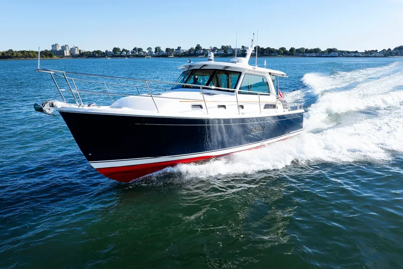 The Image of 2022 Sabre 38 SE yacht cruising on open water, showcasing sleek design and performance. - 0