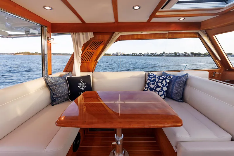 Slide: The Image of Luxurious interior of 2022 Sabre 38 SE yacht with elegant seating and scenic water view. - 12