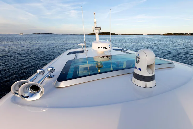 Slide: The Image of 2022 Sabre 38 SE yacht deck with Garmin and FLIR equipment on calm water. - 30