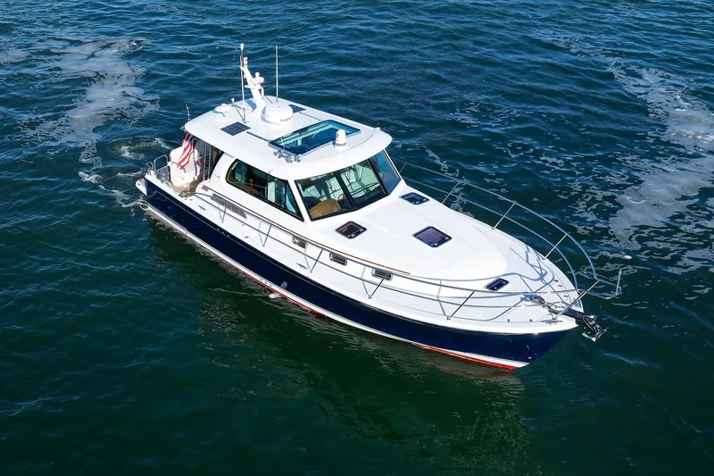 Slide: The Image of 2022 Sabre 38 SE yacht cruising on open water, aerial view. - 31