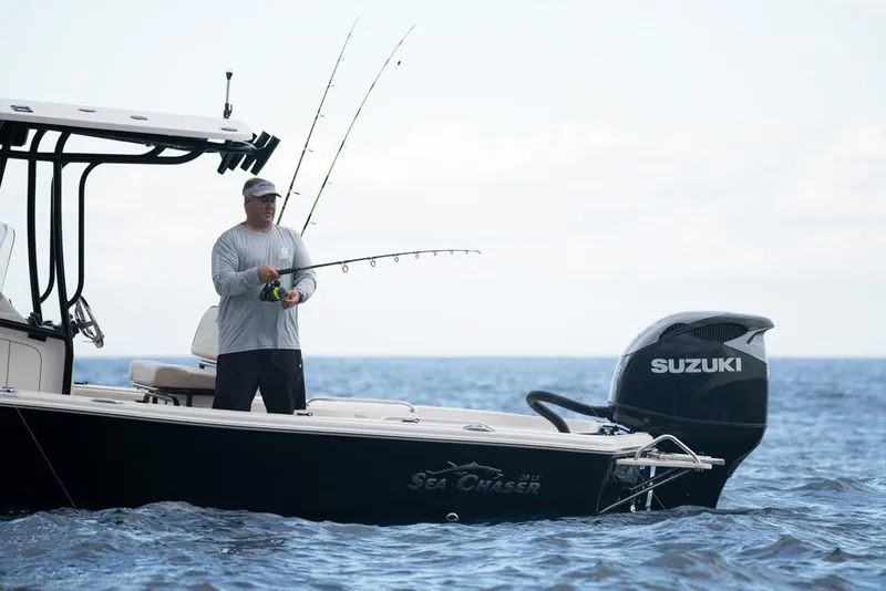 Slide: The Image of Manufacturer Provided Image: Sea Chaser 26 LX 2026 boat on water with two people. - 4