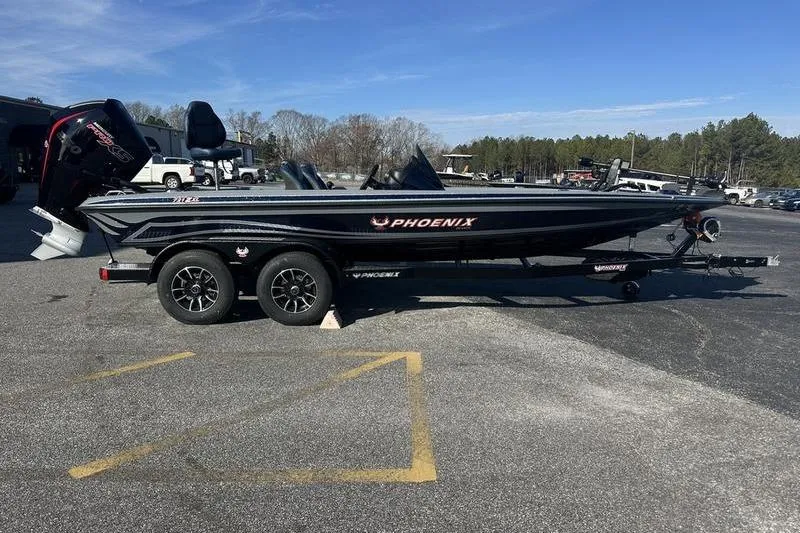 The Image of 2026 Phoenix 721 ZXL boat on trailer in parking lot, clear sky background. - 1