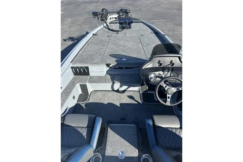 Slide: The Image of 2026 Phoenix 721 ZXL boat interior with steering wheel and seating. - 12