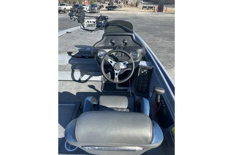 Slide: The Image of 2026 Phoenix 721 ZXL boat interior with steering wheel and dashboard controls. - 13