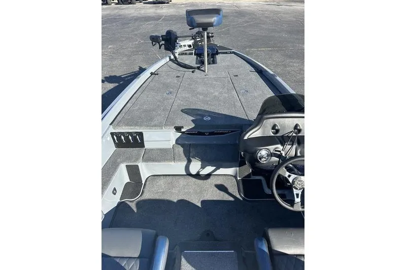 Slide: The Image of 2026 Phoenix 721 ZXL boat interior with steering wheel and seating. - 14