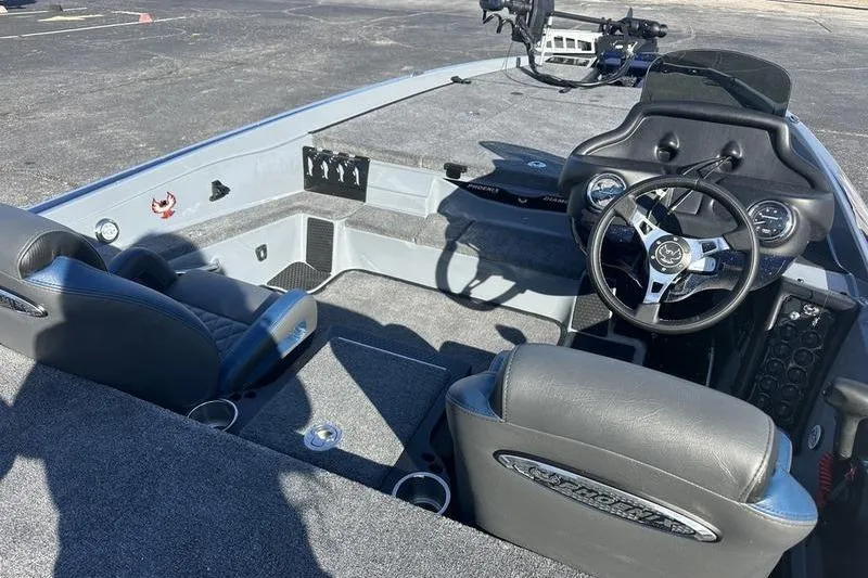 Slide: The Image of 2026 Phoenix 721 ZXL boat interior with steering wheel and seating. - 16