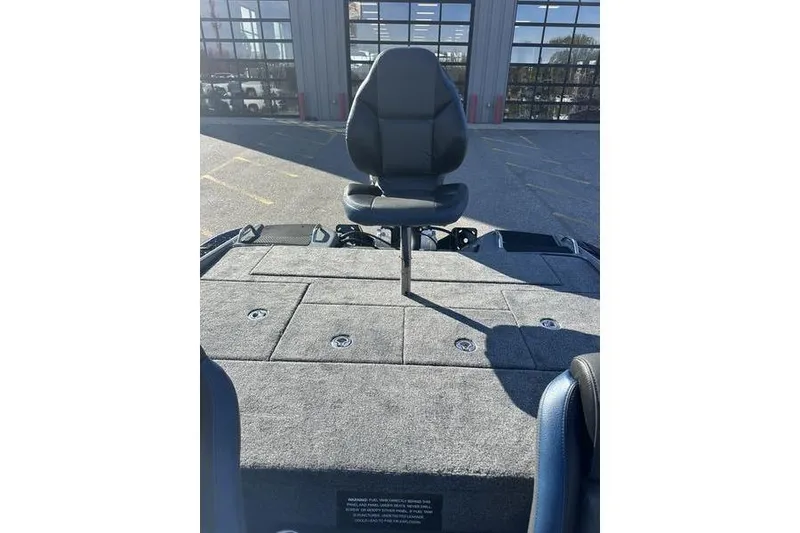 Slide: The Image of 2026 Phoenix 721 ZXL boat with elevated seat on a carpeted deck. - 9