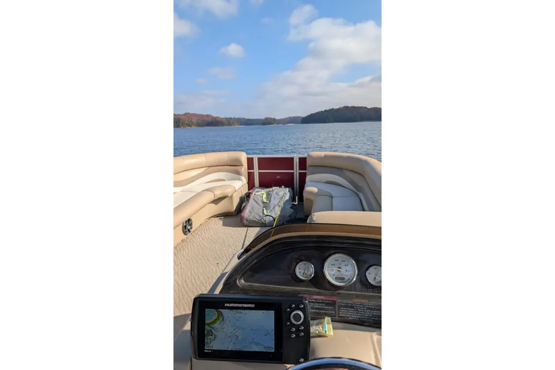 Slide: The Image of 2012 Crest CHILLER CP2 boat interior with lake view and navigation system. - 11