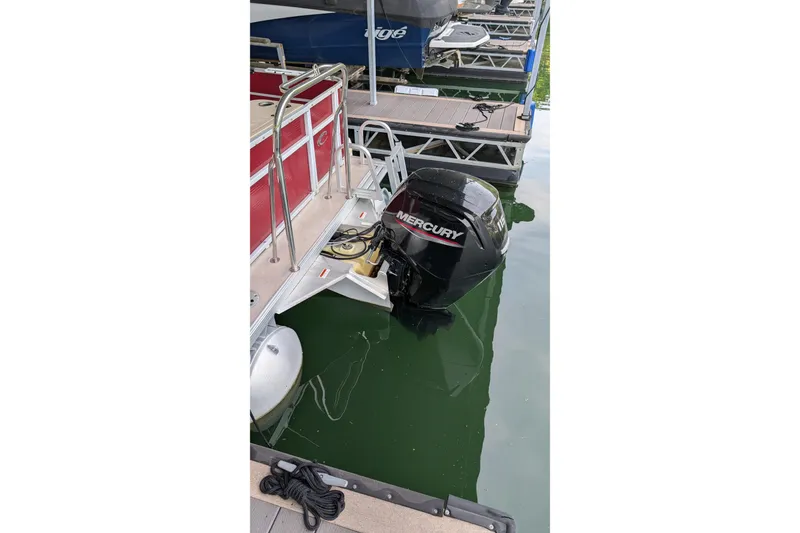 Slide: The Image of Pontoon boat with Mercury outboard motor docked, Crest CHILLER CP2, 2012 model. - 13