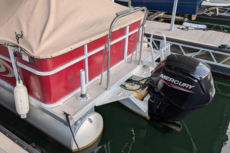 Slide: The Image of Pontoon boat with Mercury engine, Crest CHILLER CP2, 2012 model, docked at marina. - 14