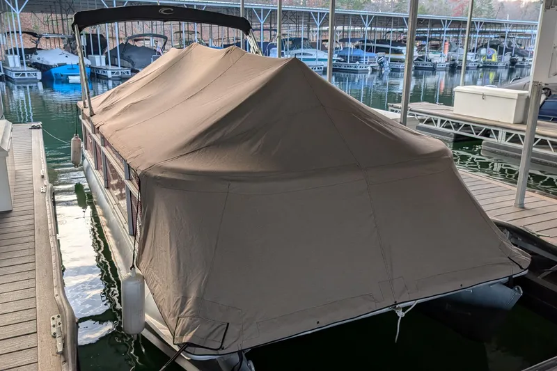 Slide: The Image of Covered 2012 Crest CHILLER CP2 pontoon boat docked at marina. - 15