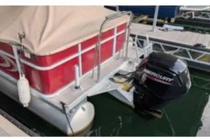Slide: The Image of 2012 Crest CHILLER CP2 pontoon boat with Mercury outboard motor docked at marina. - 3