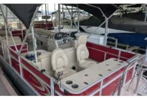 Slide: The Image of 2012 Crest CHILLER CP2 pontoon boat with red exterior and beige seating. - 6