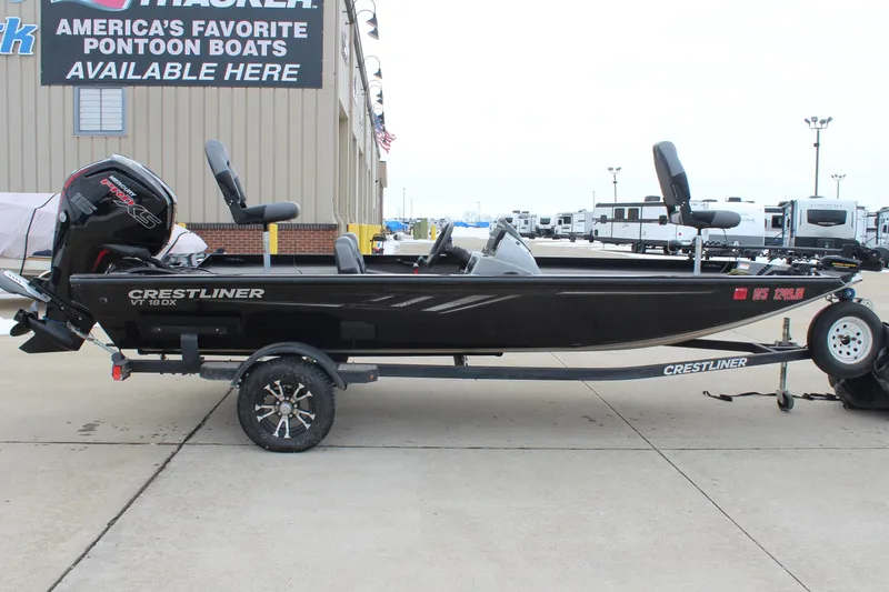 The Image of 2019 Crestliner VT 18 boat on trailer, parked outside dealership. - 0