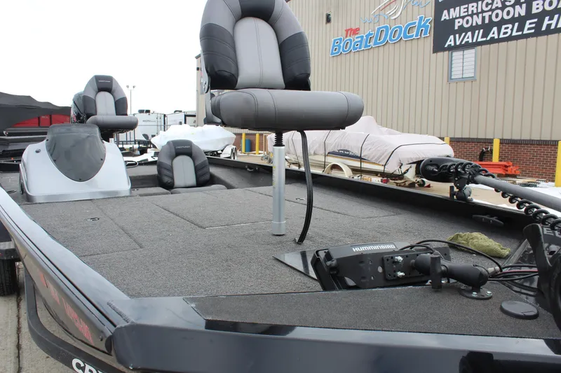 Slide: The Image of 2019 Crestliner VT 18 fishing boat with seating and equipment at a dealership. - 14