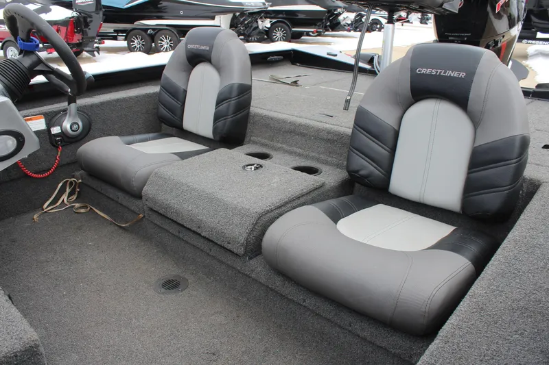 Slide: The Image of 2019 Crestliner VT 18 boat interior with dual seats and steering wheel. - 16