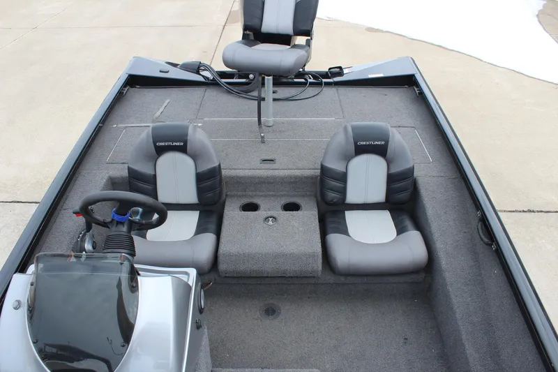 Slide: The Image of 2019 Crestliner VT 18 boat interior with three seats and steering console. - 19