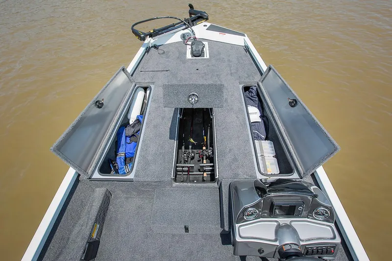 Slide: The Image of Manufacturer Provided Image: 2019 Crestliner VT 18 boat with open storage compartments on a lake. - 23
