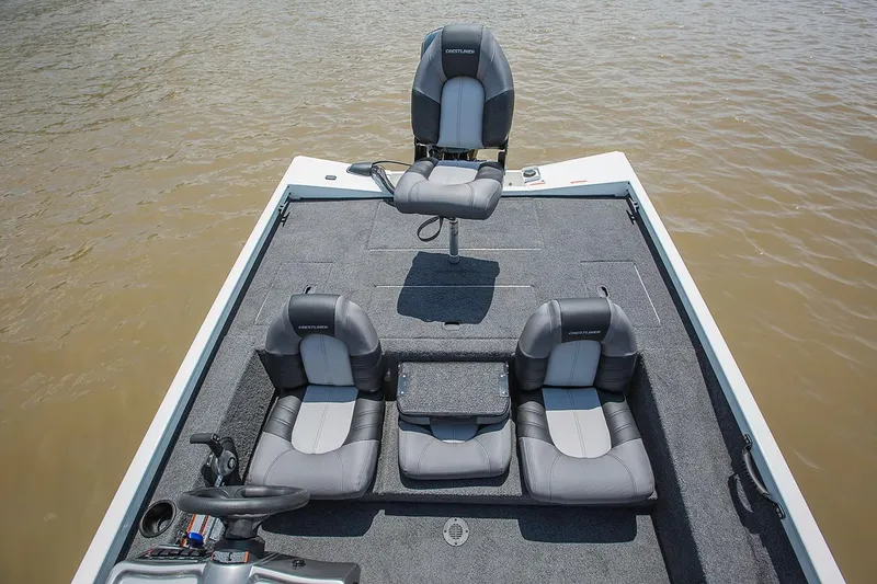 Slide: The Image of Manufacturer Provided Image: 2019 Crestliner VT 18 boat interior with seating and steering wheel on water. - 29